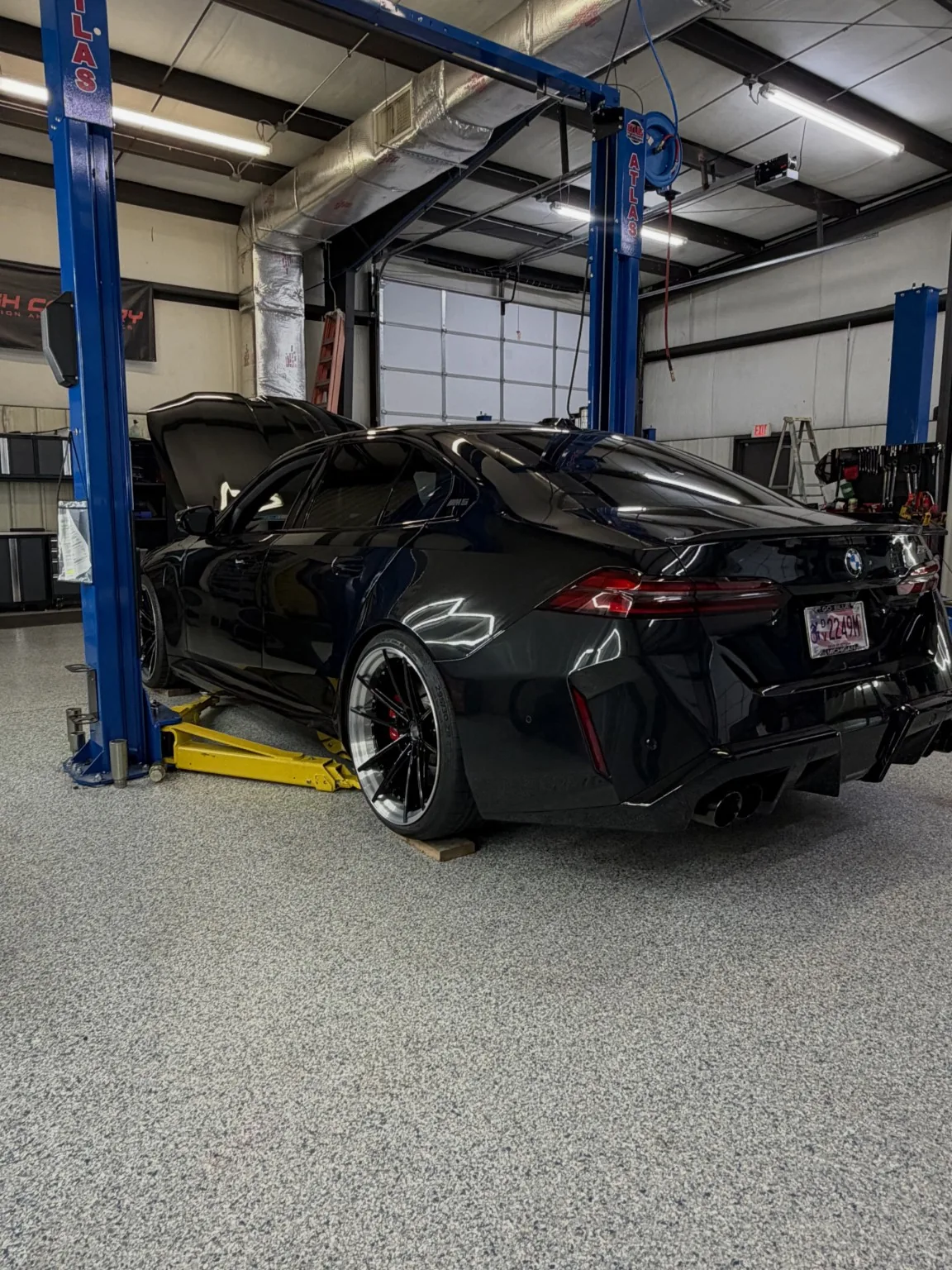 Black BMW inside the workshop