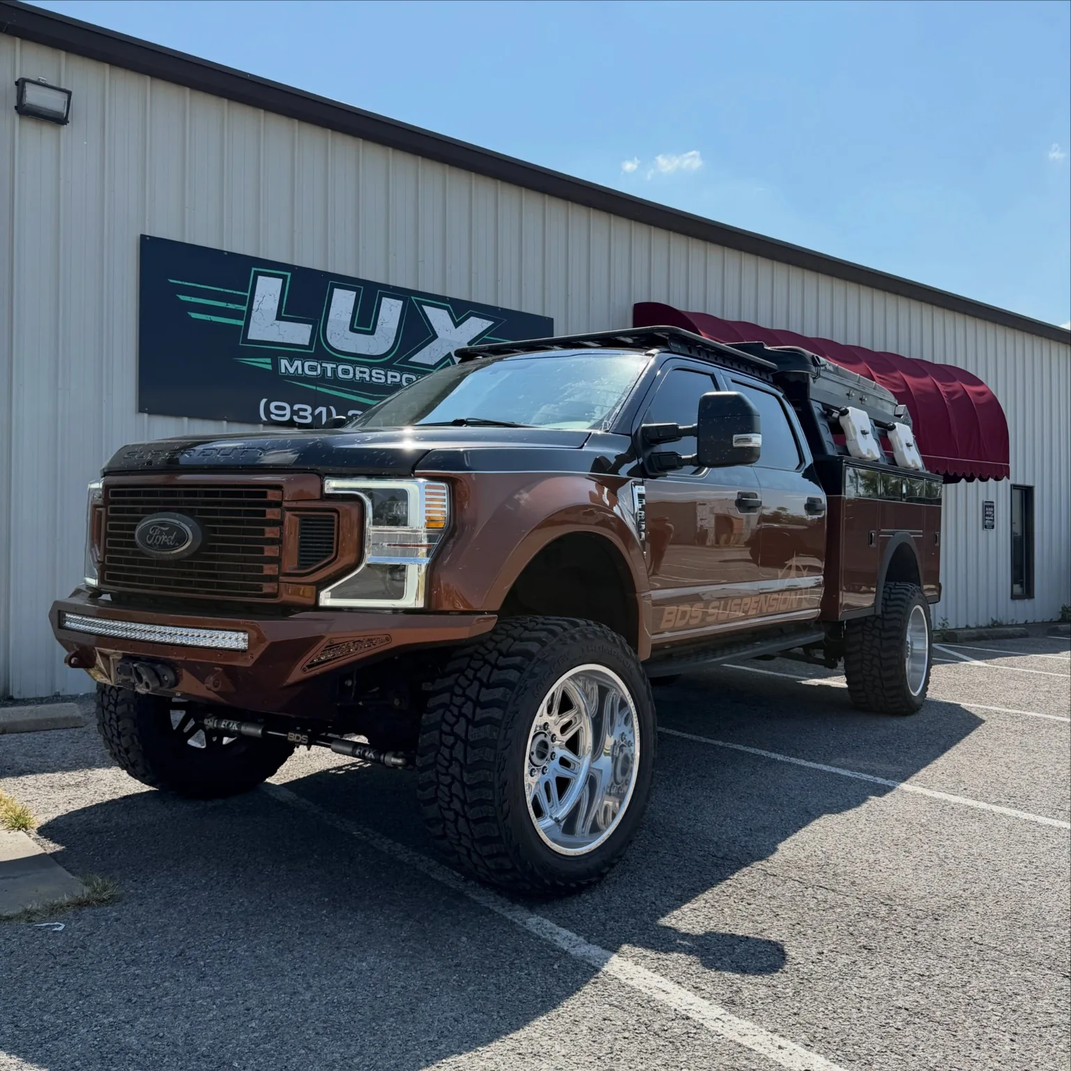 Customized bronze Super Duty truck at LUX Motorsports