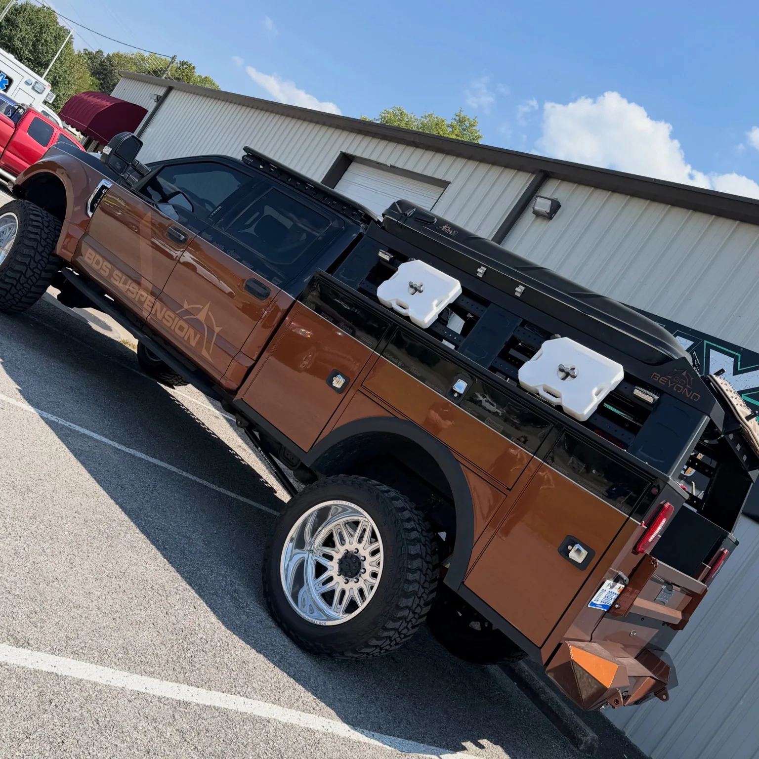 Customized off-road service truck outside the shop