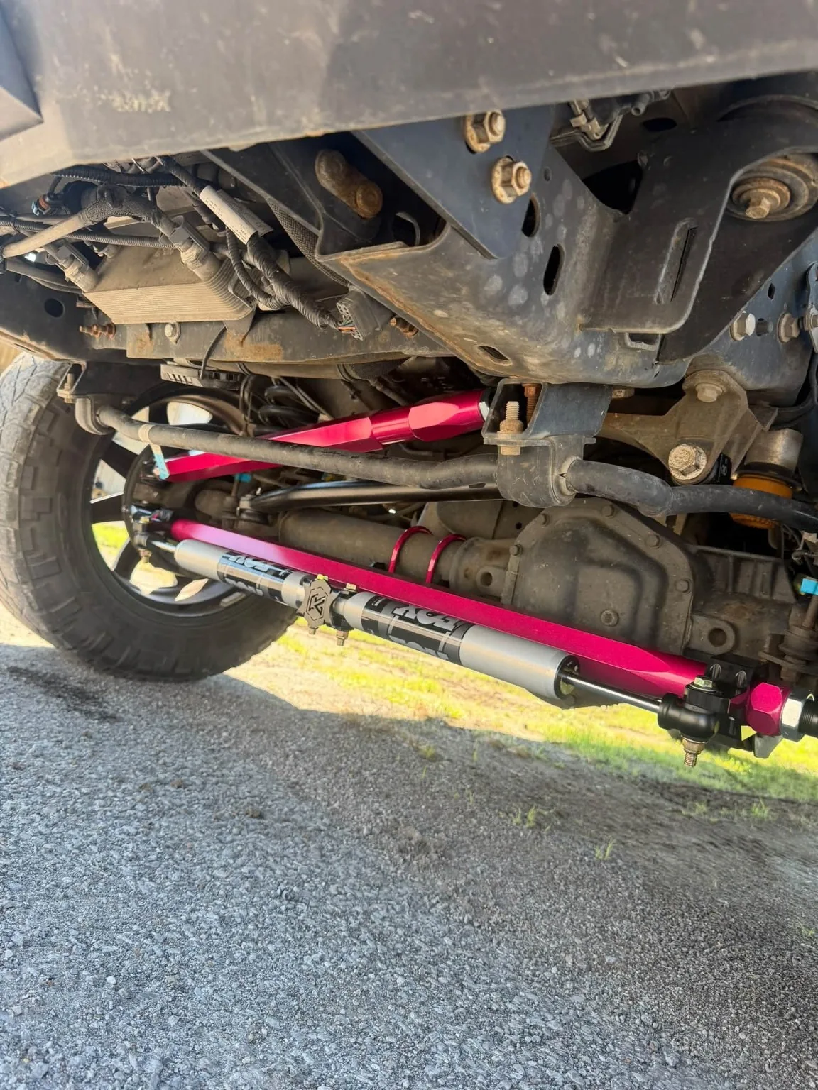 Underbody view of upgraded steering and suspension parts