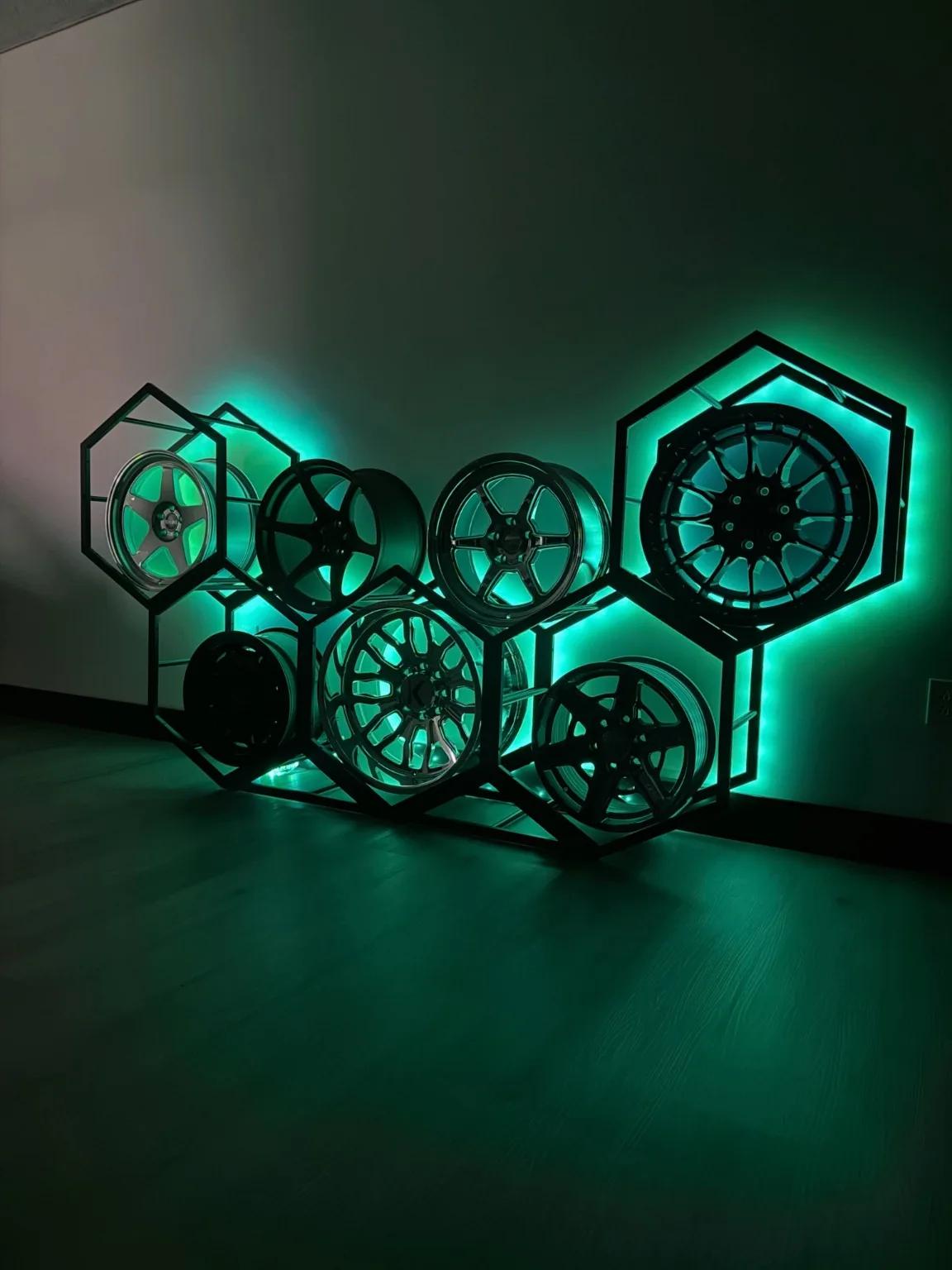 Aftermarket wheels illuminated with teal lights